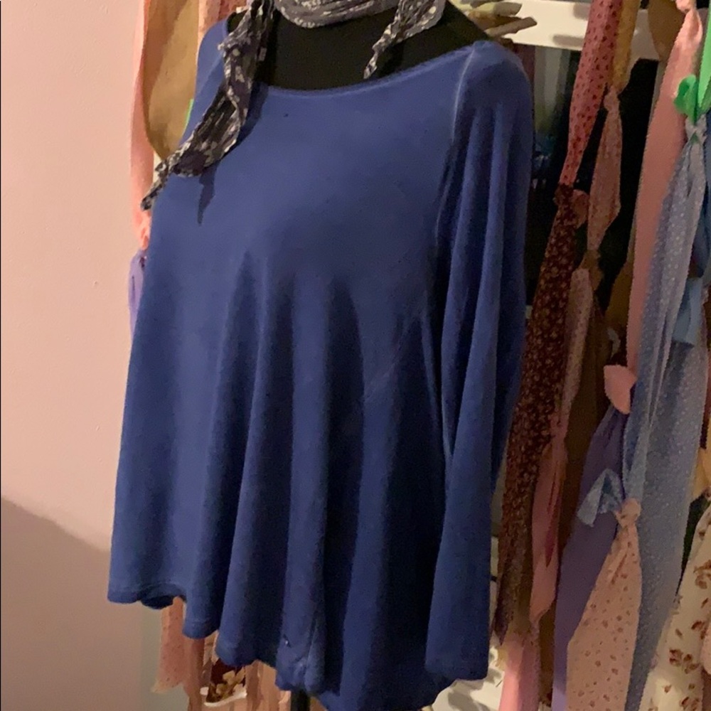 Slightly distressed women’s long sleeved top